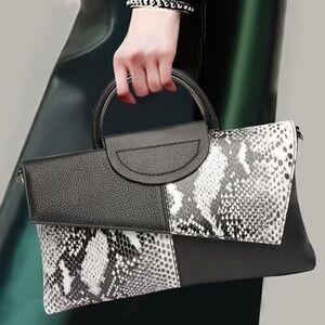 Luce black and white snakeskin clutch bag